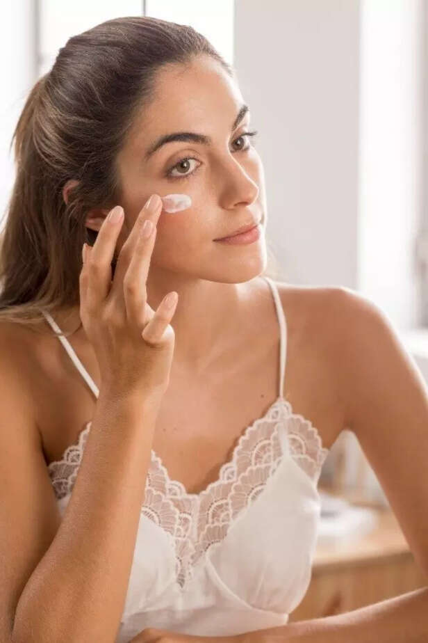 Woman applying sunscreen